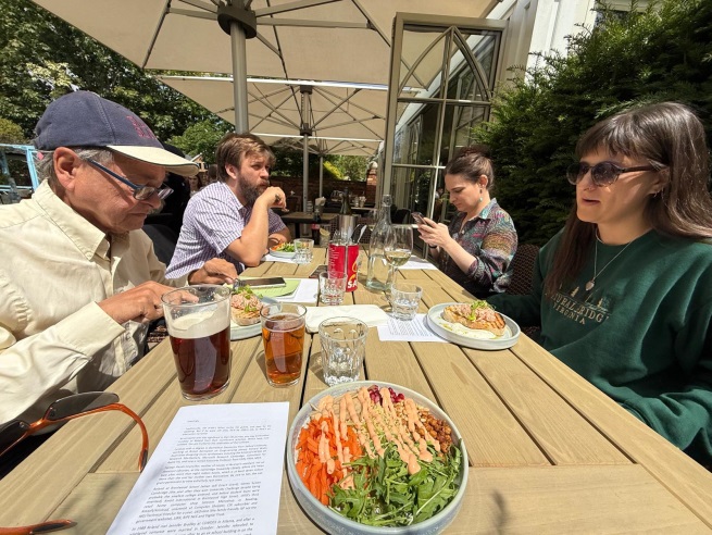 Family and friends having lunch together outdoors
